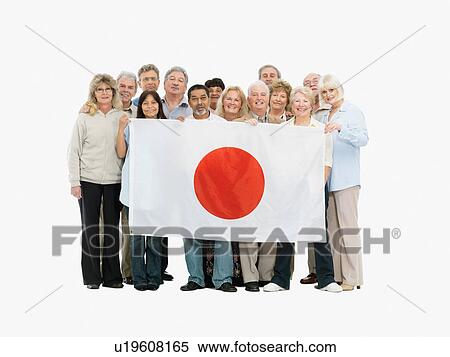 Stock Photography - Group of people holding a Japanese flag. Fotosearch