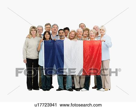 Stock Image - Group of people holding the flag of France. Fotosearch
