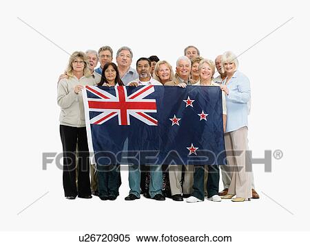 Group of people holding the New Zealand flag View Large Photo Image Stock Photography - Group of people holding the New Zealand flag. Fotosearch