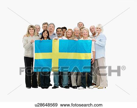 Stock Photo - Group of people holding the Swedish flag. Fotosearch