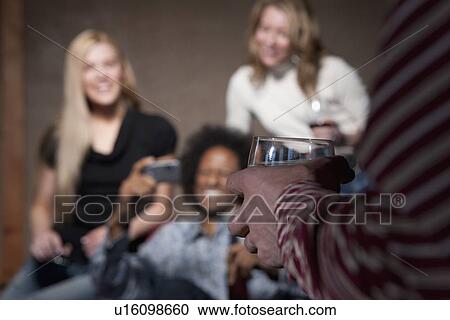 Group of people socializing at a party View Large Photo Image Stock Image - Group of people socializing at a party. Fotosearch