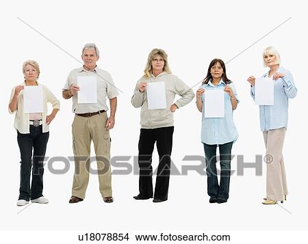 Group of people standing in a row holding papers View Large Photo Image Picture - Group of people standing in a row holding papers. Fotosearch