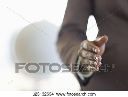 Picture - Hand extended for handshake. Fotosearch