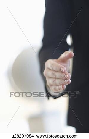 Picture - Hand extended for handshake. Fotosearch