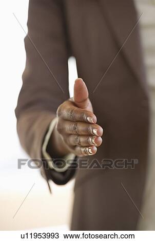 Stock Image - Hand extended for handshake. Fotosearch