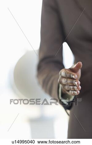 Stock Image - Hand extended for handshake. Fotosearch