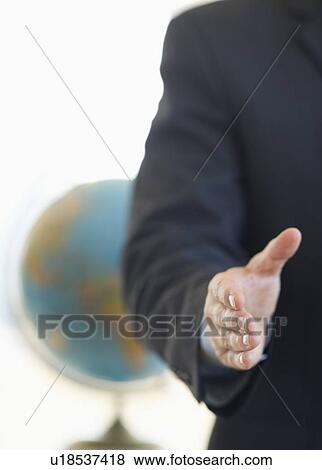 Stock Photo - Hand extended for handshake. Fotosearch