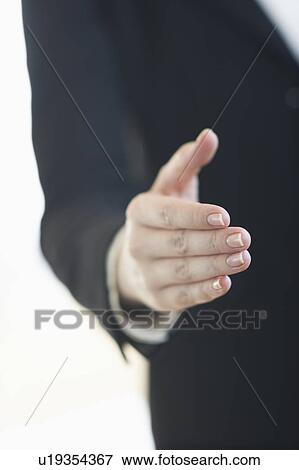 Stock Photo - Hand extended for handshake. Fotosearch