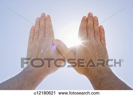 Hands framing sunshine View Large Photo Image Stock Image - Hands framing sunshine. Fotosearch