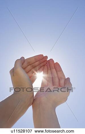 Stock Photo - Hands framing sunshine. Fotosearch