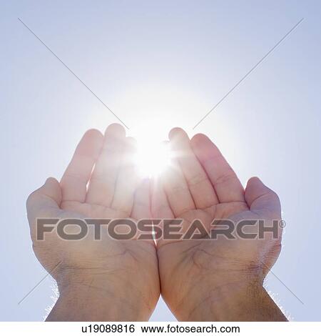 Hands framing sunshine View Large Photo Image Stock Photograph - Hands framing sunshine. Fotosearch