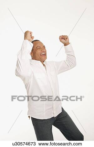 Happy man with his arms raised View Large Photo Image Stock Image - Happy man with his arms raised. Fotosearch
