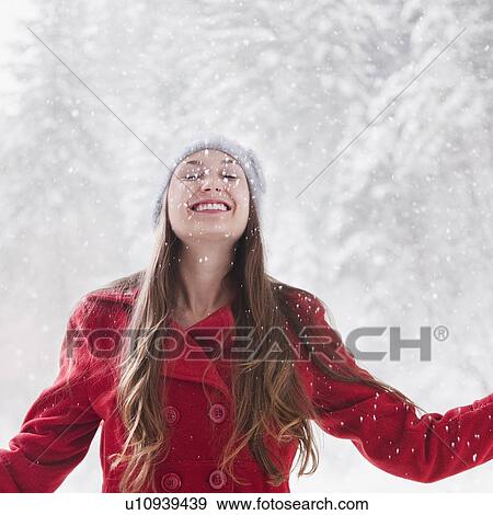 Happy woman outside on a snowy day View Large Photo Image Stock Photo - Happy woman outside on a snowy day. Fotosearch