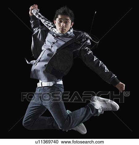 Stock Image - Hip hop dancer jumping in the air. Fotosearch