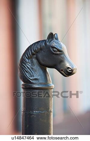 Picture - Iron statue of a horse's head on top of a post. Fotosearch