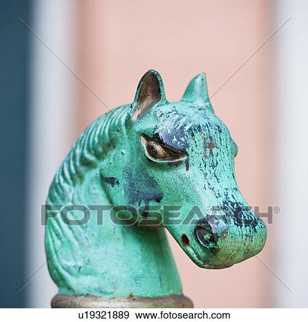 Stock Photo - Iron statue of a horse's head. Fotosearch