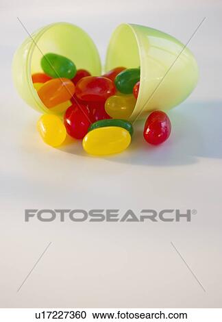 Jelly beans in a plastic Easter egg View Large Photo Image Stock Image - Jelly beans in a plastic Easter egg. Fotosearch