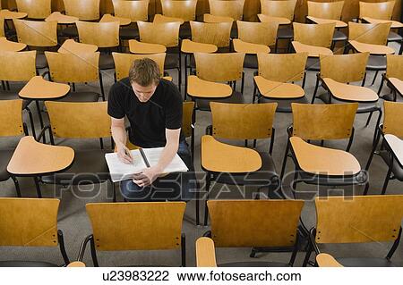 Last student left in college lecture hall View Large Photo Image Stock Image - Last student left in college lecture hall. Fotosearch