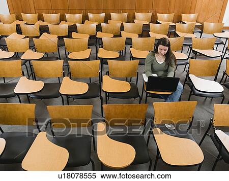 Stock Photography - Last student left in college lecture hall. Fotosearch