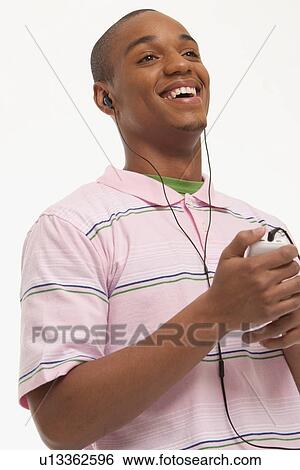 Laughing man wearing earphones View Large Photo Image Stock Photograph - Laughing man wearing earphones. Fotosearch