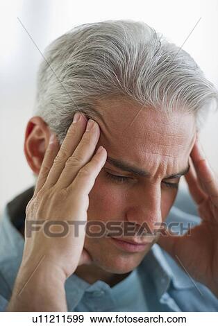 Stock Photo - Man with a headache. Fotosearch
