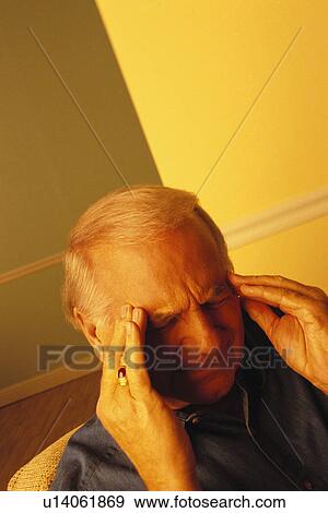 Stock Photo - Man with a headache. Fotosearch