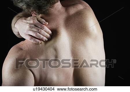 Man with shoulder pain View Large Photo Image Picture - Man with shoulder pain. Fotosearch