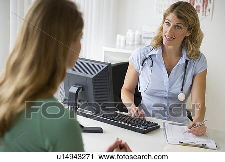 Medical consultation in exam room View Large Photo Image Stock Image - Medical consultation in exam room. Fotosearch