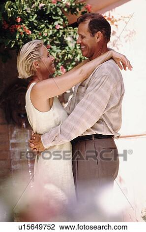 Middle aged couple embracing View Large Photo Image Stock Image - Middle aged couple embracing. Fotosearch