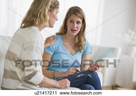 Stock Image - Mother and daughter having an argument. Fotosearch