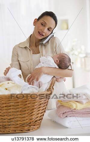 Stock Photo - Multi-tasking mother. Fotosearch