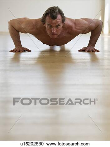 Muscular man doing push-ups View Large Photo Image Stock Image - Muscular man doing push-ups. Fotosearch