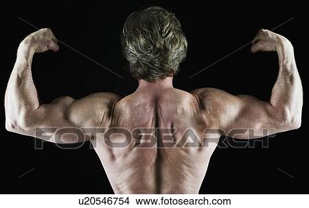 Picture - Muscular man flexing his biceps. Fotosearch
