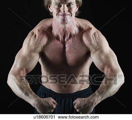 Stock Image - Muscular man flexing his muscles. Fotosearch