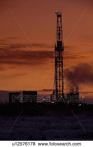 Oil drilling rig at dusk View Large Photo Image Stock Photo - Oil drilling rig at dusk. Fotosearch