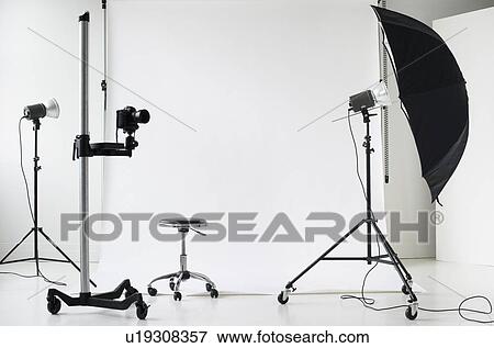 Stock Photo - Photographer's lights and camera. Fotosearch