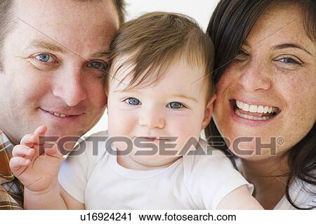 Portrait of parents and their child View Large Photo Image Stock Image - Portrait of parents and their child. Fotosearch