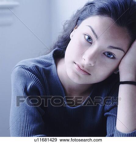 Pretty teenage girl deep in thought View Large Photo Image Stock Photo - Pretty teenage girl deep in thought. Fotosearch