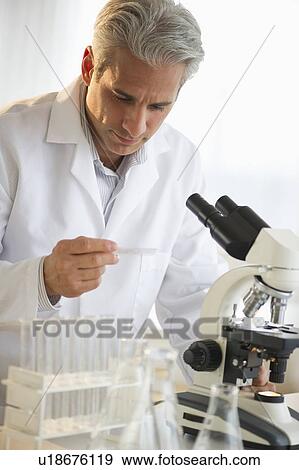 Researcher working in science lab View Large Photo Image Stock Photo - Researcher working in science lab. Fotosearch