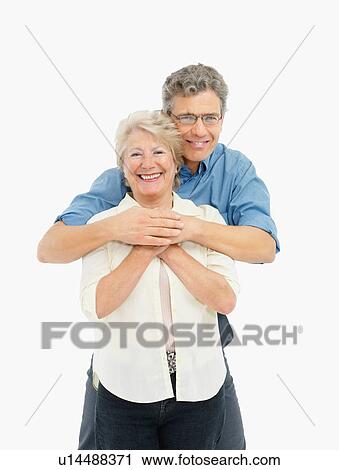 Stock Image - Retired couple embracing. Fotosearch