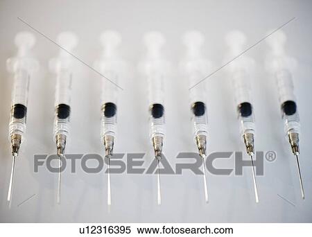 Row of medical syringes View Large Photo Image Stock Photography - Row of medical syringes. Fotosearch