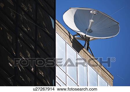 Satellite dish on top of building View Large Photo Image Picture - Satellite dish on top of building. Fotosearch