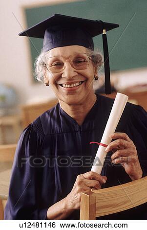 Senior student wearing graduation gown View Large Photo Image Stock Photograph - Senior student wearing graduation gown. Fotosearch