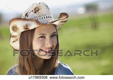 Stock Photo - Smiling cowgirl. Fotosearch