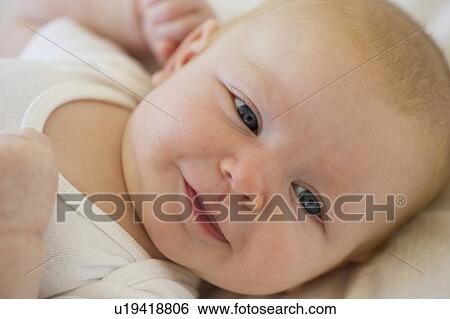 Stock Photograph - Smiling infant. Fotosearch