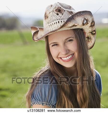 Smiling long haired cowgirl View Large Photo Image Stock Image - Smiling long haired cowgirl. Fotosearch