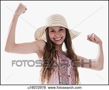 Smiling woman flexing her muscles View Large Photo Image Stock Photo - Smiling woman flexing her muscles. Fotosearch