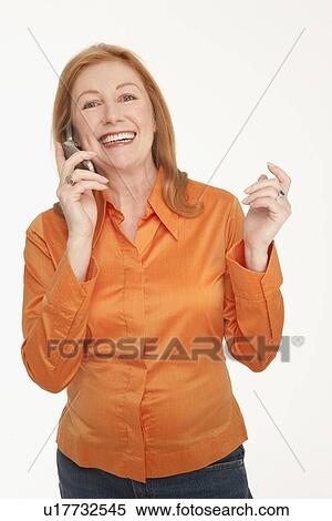 Smiling woman talking on cell phone View Large Photo Image Stock Photography - Smiling woman talking on cell phone. Fotosearch