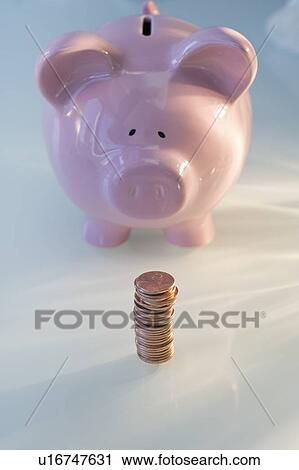 Stack of pennies in front of piggy bank View Large Photo Image Stock Image - Stack of pennies in front of piggy bank. Fotosearch