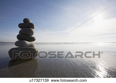 Stock Photo - Stack of rocks on the beach. Fotosearch